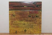 Front cover of Alice Cooper "Schools Out" vinyl record with distinctive school desk graffiti artwork