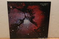 Front cover of King Crimson's Islands LP showing a cosmic nebula with stars and the album title in white text on the black background.