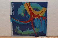 Front album cover with abstract multicolor artwork and 'Robert Plant' text on left side.