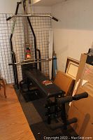 Front perspective of York 2001 weight bench with attached weight stack, lat pulldown bar overhead and padded bench seat