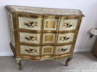 Overall front view of sideboard showing bombe-shaped front, three drawers, painted panels and cabriole legs