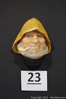 Front view of Bossons Old Salt #80 wall hanging showing fisherman's face with yellow rain hat and pipe, against a black background.