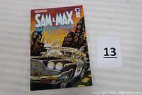 Front cover of the comic book showing Sam and Max characters in a car at night in a city.