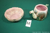 Photo of both Etruscan Majolica pottery pieces: nappy and teapot, showing their overall shape and color.