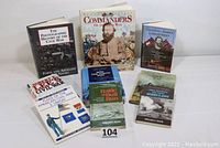 Image showing all nine books in the lot, arranged to display titles clearly.