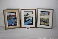 Three framed Japanese paper prints showing the set and framing details