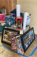 Overall lot overview showing framed photos, bobbleheads, baseball cards, posters and magazine grouped