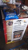 Photo of boxed Masterbuilt digital electric smoker, 30-inch model, with branding and product image on box.
