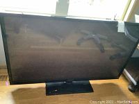 Front view of the Samsung 51-inch plasma TV on its stand, showing the screen and bezel.