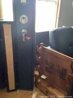 Front view of tall Barska safe showing biometric scanner and key lock