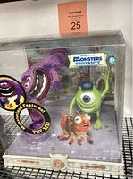 Front view of sealed original packaging containing Art and Mike Monsters University action figures with branding and promotional sticker.