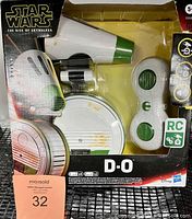 Front view of sealed Star Wars The Rise of Skywalker D-O toy packaging including the remote control and droid toy.