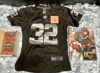 Josh Allen black #32 NFL jersey, box of trading cards, and Beckett magazine displayed