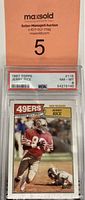 Front view of the 1987 Topps Jerry Rice trading card in PSA graded holder showing the playing image and 49ers team name.