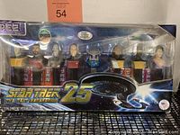 Front view of the Star Trek 25th Anniversary PEZ dispenser set in original sealed packaging with visible characters and branding.