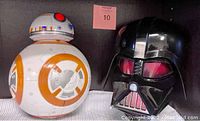 Photo showing BB-8 and Darth Vader Star Wars 3D wall lights side by side on a shelf, both about 12 inches tall.