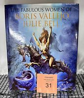 Front cover of the oversized hardcover book showing a fantasy illustration of a woman riding a dragon-like creature with the title 'The Fabulous Women of Boris Vallejo and Julie Bell'.