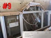 White vinyl shaped window unit with arched top, wrapped in protective packaging