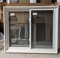 Front view of the white vinyl double slider tilt window showing frame and glass