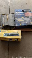 Mastercraft Wet Tile Saw and Maestro Tile Cutter with their original boxes, showing overall condition and packaging.