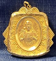 Front side relief depicting Jesus with Sacred Heart motif