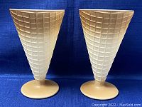 Two ombré waffle cone style glass sundae cups front view showing cone texture and round base