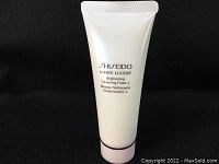 Front view of white tube with Shiseido branding and product name showing Shiseido White Lucent Brightening Cleansing Foam.