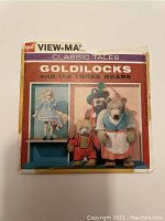 Front cover of the View-Master set with taped edges and discoloration, showing title and bear family illustration