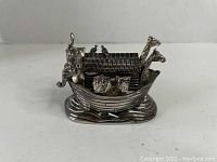 Noah's Ark silver-tone music box shown from front angle on white background.