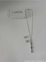 Full view of the vintage costume jewelry set showing necklace and earrings with Latasia box