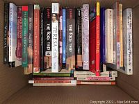 Photo showing a box of books including titles like Whale Rider, Bill Bryson, The Book Thief, Teresa of Avila, and others.