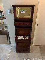 Full front view of cabinet showing overall condition and design