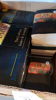 Box containing multiple hardcover books by Tim LaHaye and Jerry B. Jenkins from the Left Behind series, with visible titles on covers and spines.
