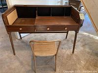 Front view of desk and folding chair together