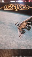 Front cover of Boston "Third Stage" vinyl record album showing spacecraft artwork with Boston logo