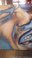 Photo of the Joe Cocker Sheffield Steel vinyl album cover showing stylized close-up face artwork.