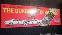 Red rectangular box labeled 'THE DUKES OF HAZZARD' with images of police cars and the Confederate flag, displaying the packaging of the LCD Quartz watch.
