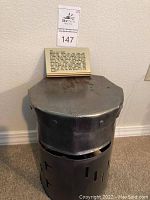 Full front view of helmet showing overall form, visor slit and base skirt.