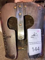 Front view showing skull-style eye openings, nasal guard and inventory tag