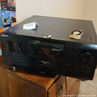 Front view of Sony Mega Storage CD changer, showing keypad and disc door.