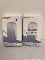 Photo showing two wireless mouse packages side by side, both labeled as Wireless Mouse, model MX220, made in China.