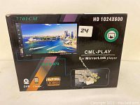 Front view of the product box showing model 7701CM, HD 1024x600 resolution, and Full HD 1080 support.