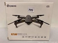 Front of the Eachine E58 Pocket Drone box showing the drone image, brand, and key features like Wi-Fi and camera, age 14+ recommended.