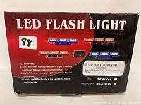 Photo of the front of the LED Flash Light box showing image of product and flashing modes