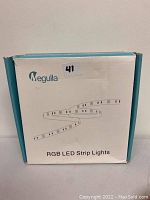 Box of Megulla RGB LED strip lights showing brand and product type.
