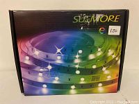 Image of SueMore RGB LED strip lights original packaging box showing colorful LED strip illustration and brand name.
