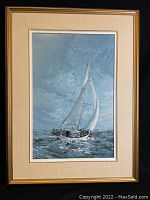 Front view of acrylic print showing a sailing boat on the sea with textured waves and cloudy sky, signed by James Keirstead, matted and framed in gold.
