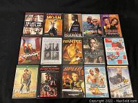 Two images showing a total of 25 assorted DVD movie cases in good used condition.