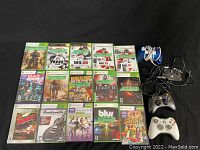 15 Xbox and Xbox 360 game cases laid out on black surface, titles clearly visible including NHL series, Gears of War 3, Fable 2, and others.