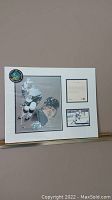 Framed collectible artwork and photo of Wayne Gretzky, labeled with 'JCP 100 Greatest' logo and a numbered edition certificate.